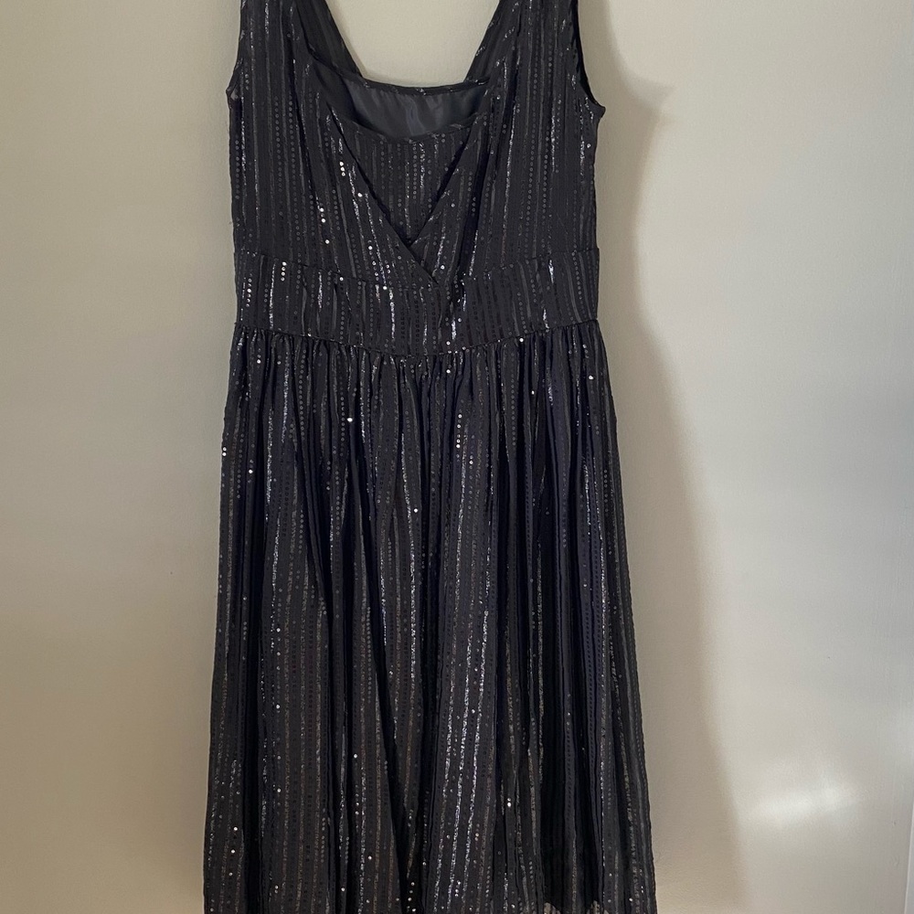 Calvin Klein sleeveless dress with vertical sparkle accents.